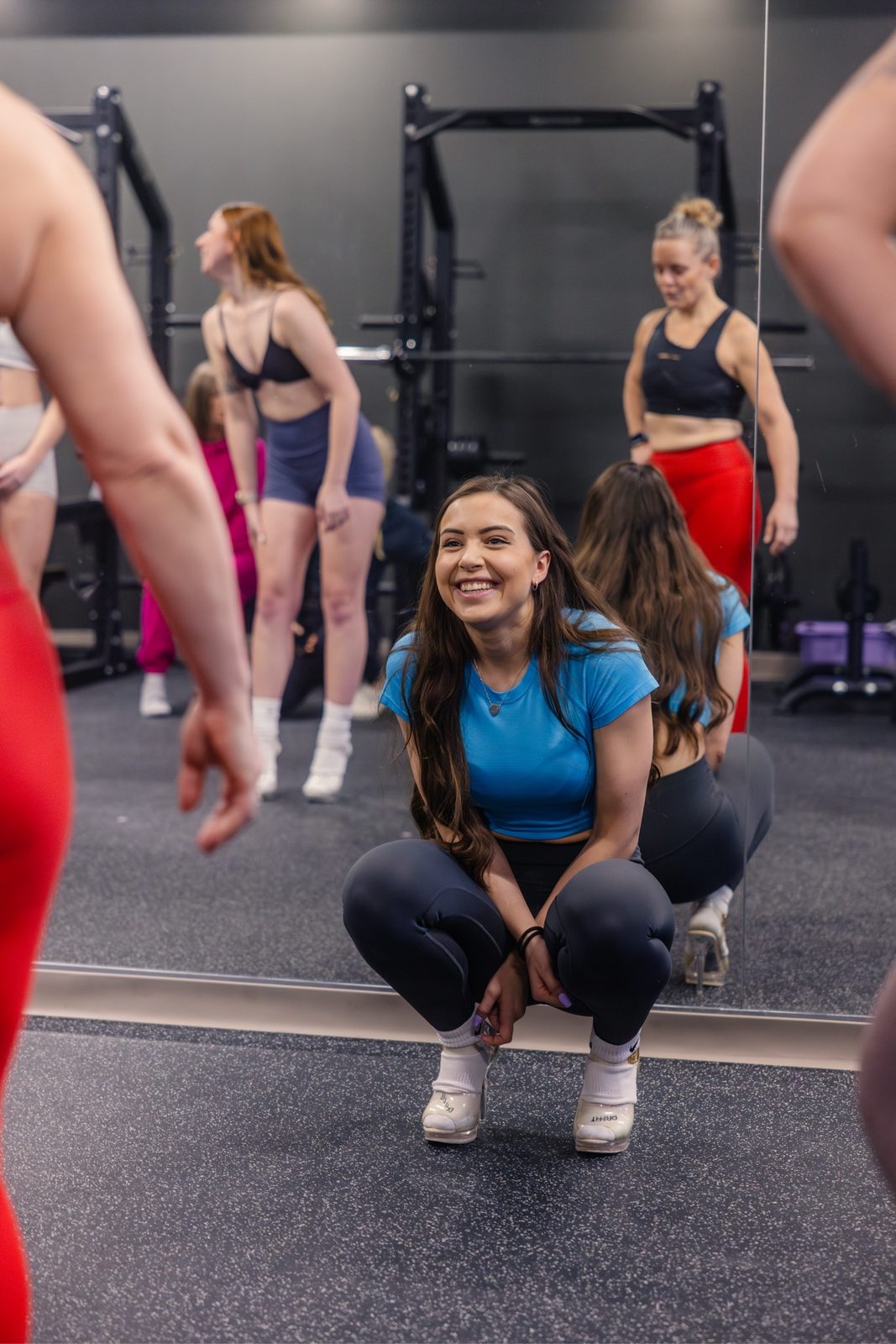 Meredith Parry smiling during a posing coaching session at the Urban Fitness Ottawa studio.