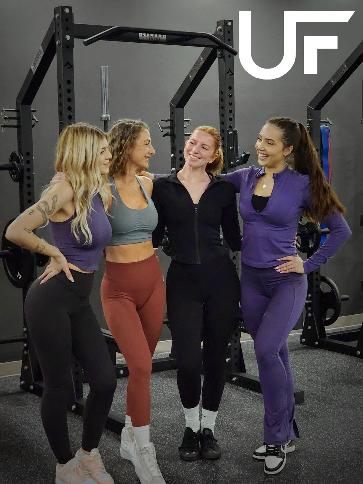 Four women from a small group training session together in the studio.
